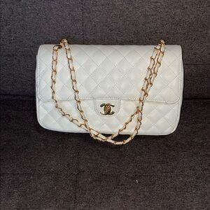 Ivory quilted leather shoulder bag with gold chain strap